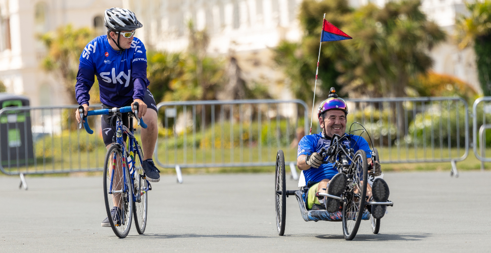 Two cyclists take part in the Rehabilitation Triathlon 